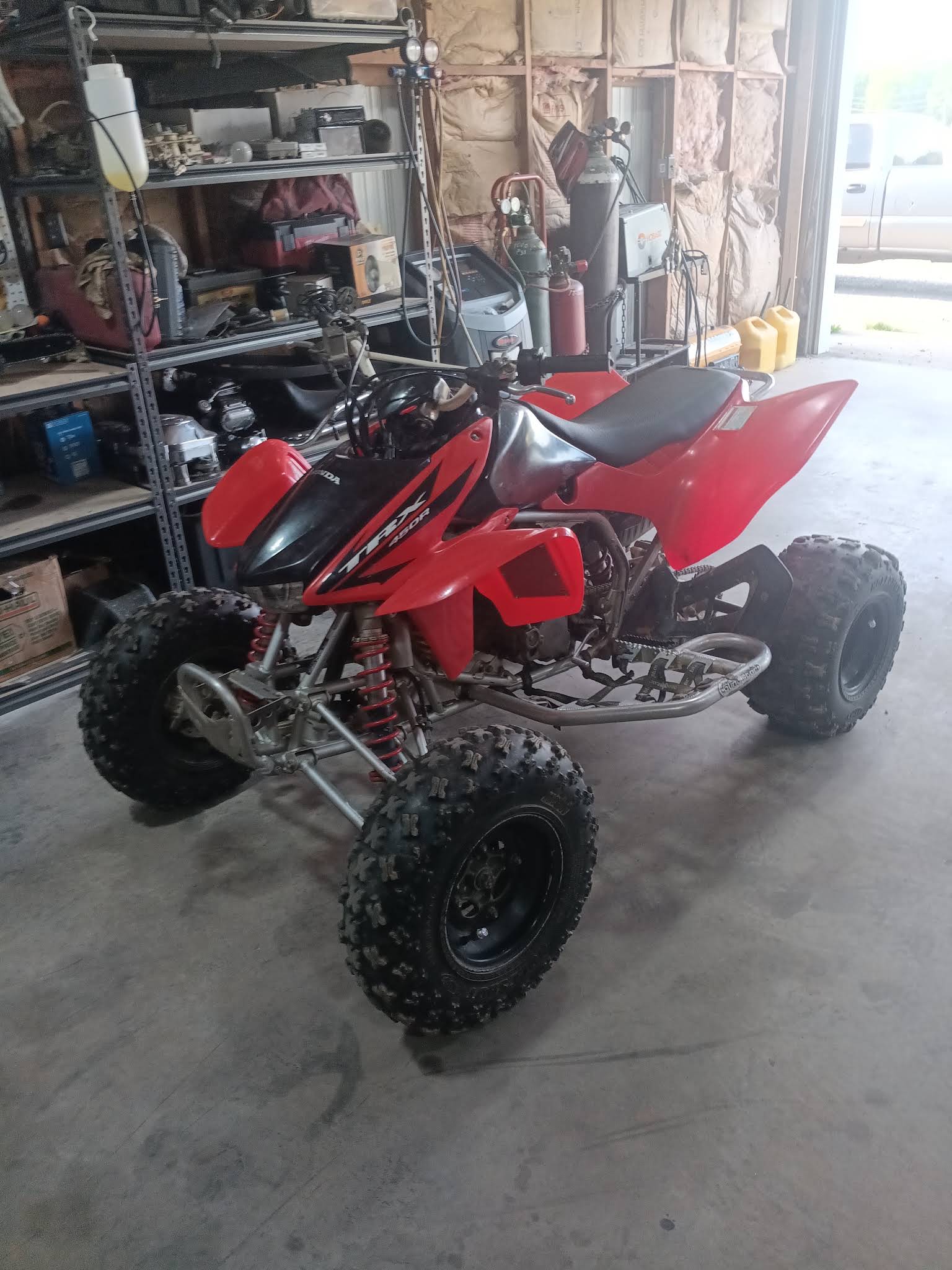 Honda TRX 450R ATV inside the shop for service